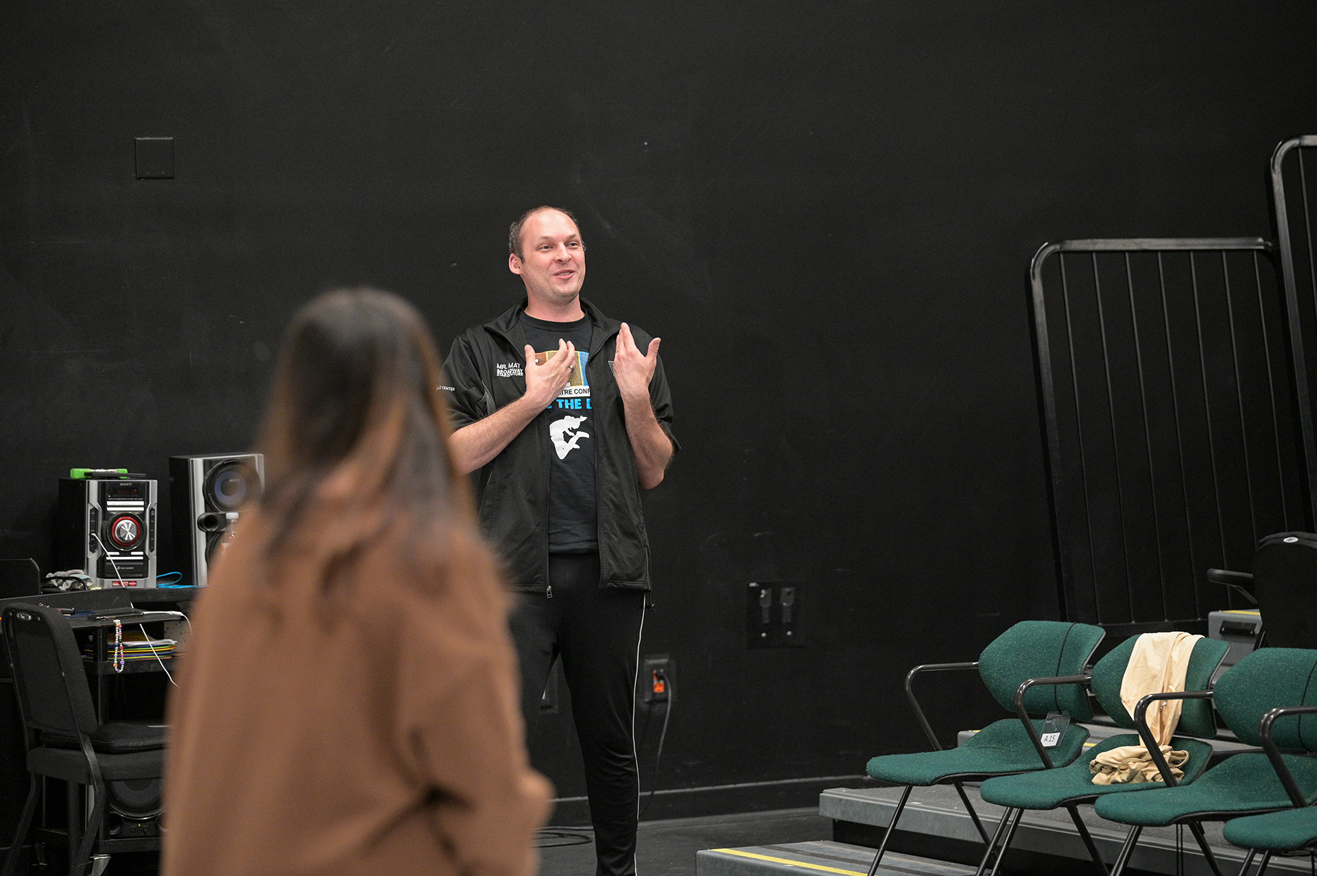 Patel instructor talking to a student.