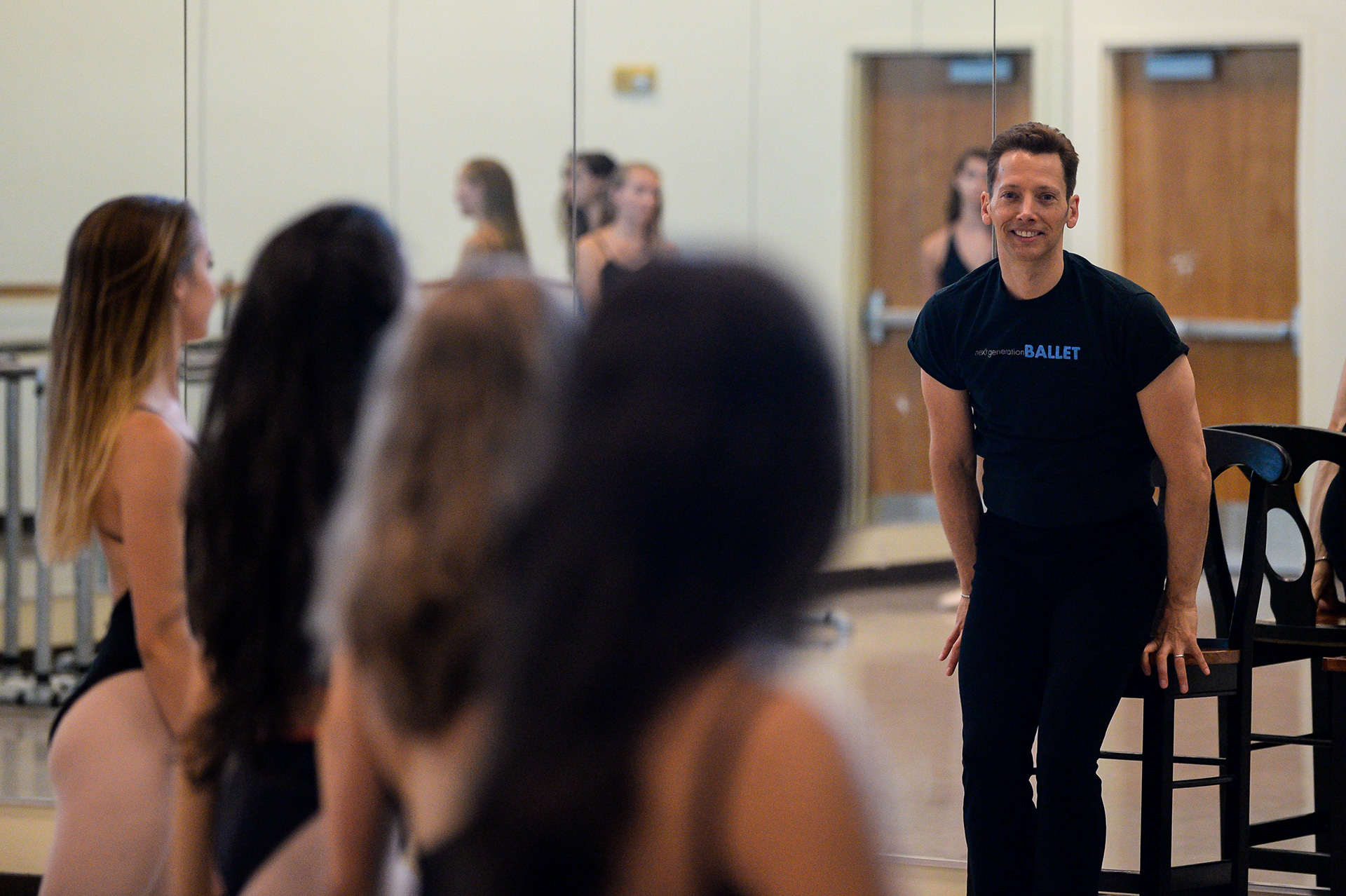 Ballet instructor talking to students.