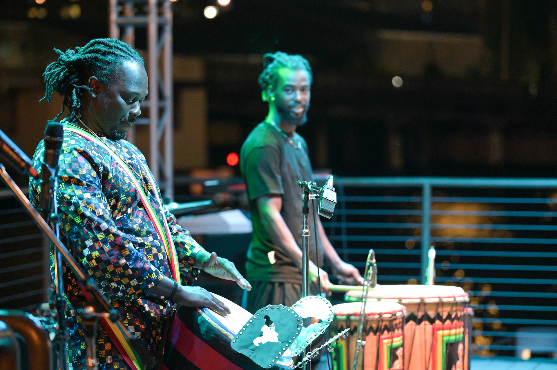 African American drummers performing on stage at the Riverwalk.